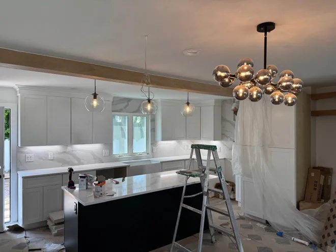 White kitchen & chandelier — Kitchen overview