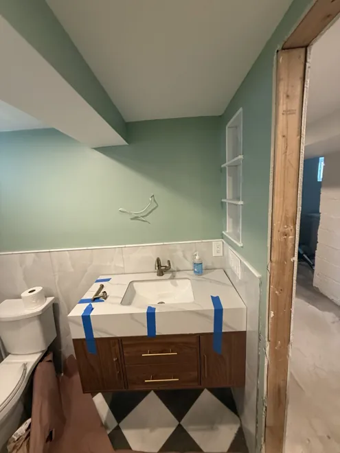 Glass shower & floating vanity — Vanity & floor tile