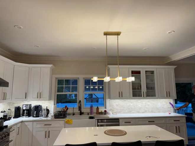 White kitchen & chandelier — Kitchen lighting & finishes