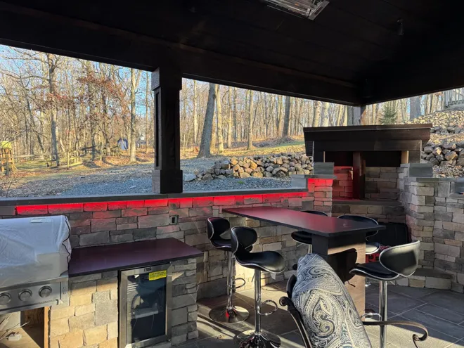 Outdoor pavilion & kitchen — Outdoor kitchen · red accent lighting