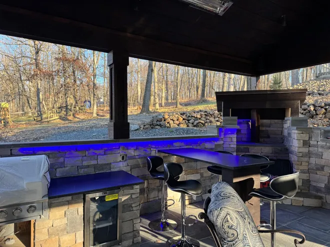 Outdoor pavilion & kitchen — Outdoor kitchen · blue accent lighting