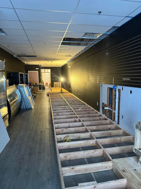 Retail renovation · Harrison — Platform framing & utility rough-in