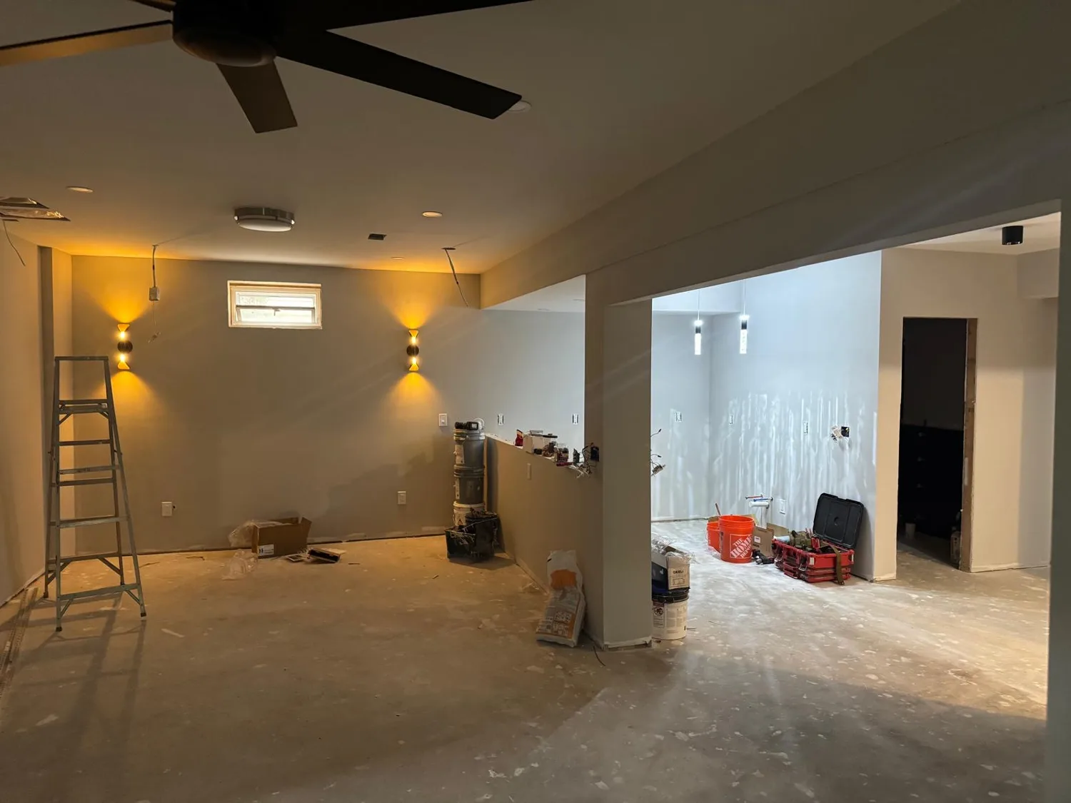 Union basement renovation with recessed lights, wall sconces and pendant lighting during finishing